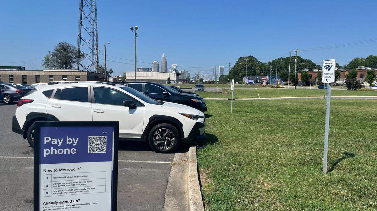 New signs posted at Amtrak station on North Tryon Street in Charlotte say guests must now pay for parking.