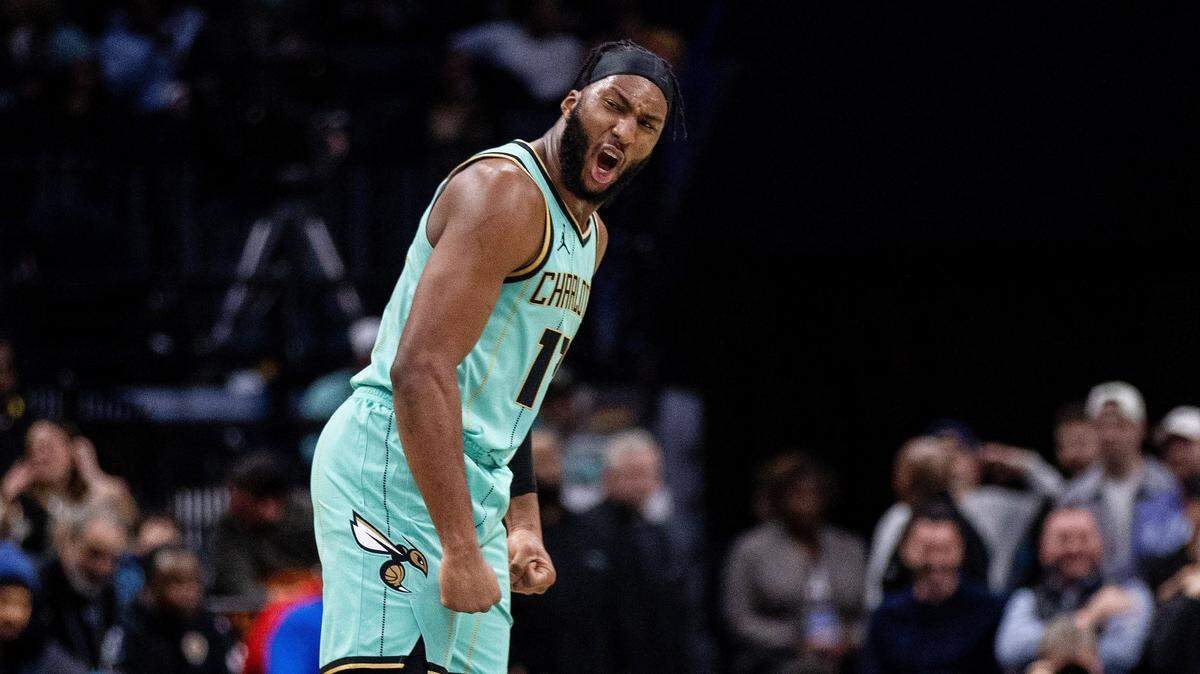 Charlotte Hornets forward Josh Okogie (12) celebrates during the second quarter against the Portland Trail Blazers at Spectrum Center.