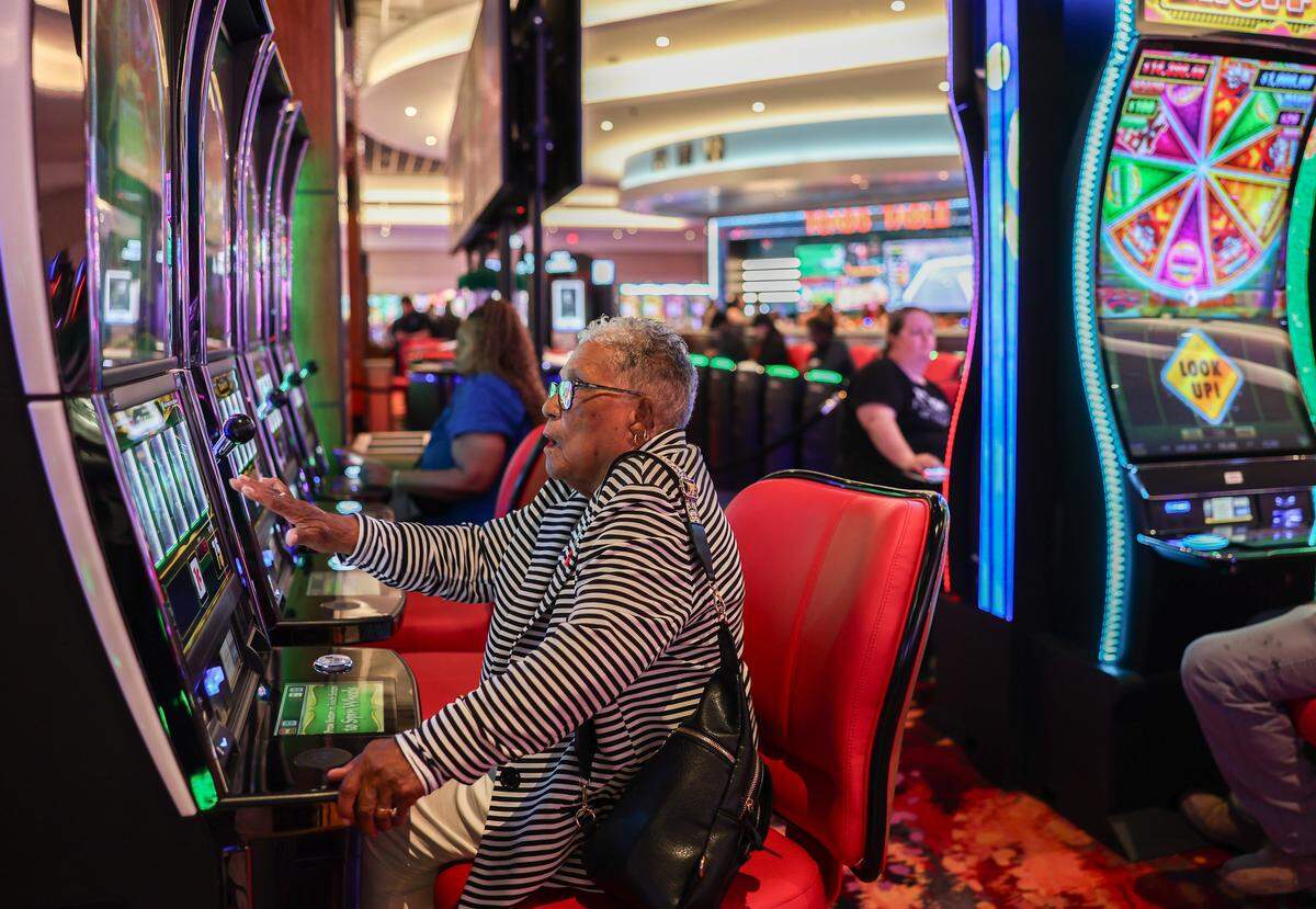 A woman gambles during the opening of the first part of the Catawba Indians' Catawba Two Kings Casino in Kings Mountain, N.C., on Wednesday, May 20, 2026. 