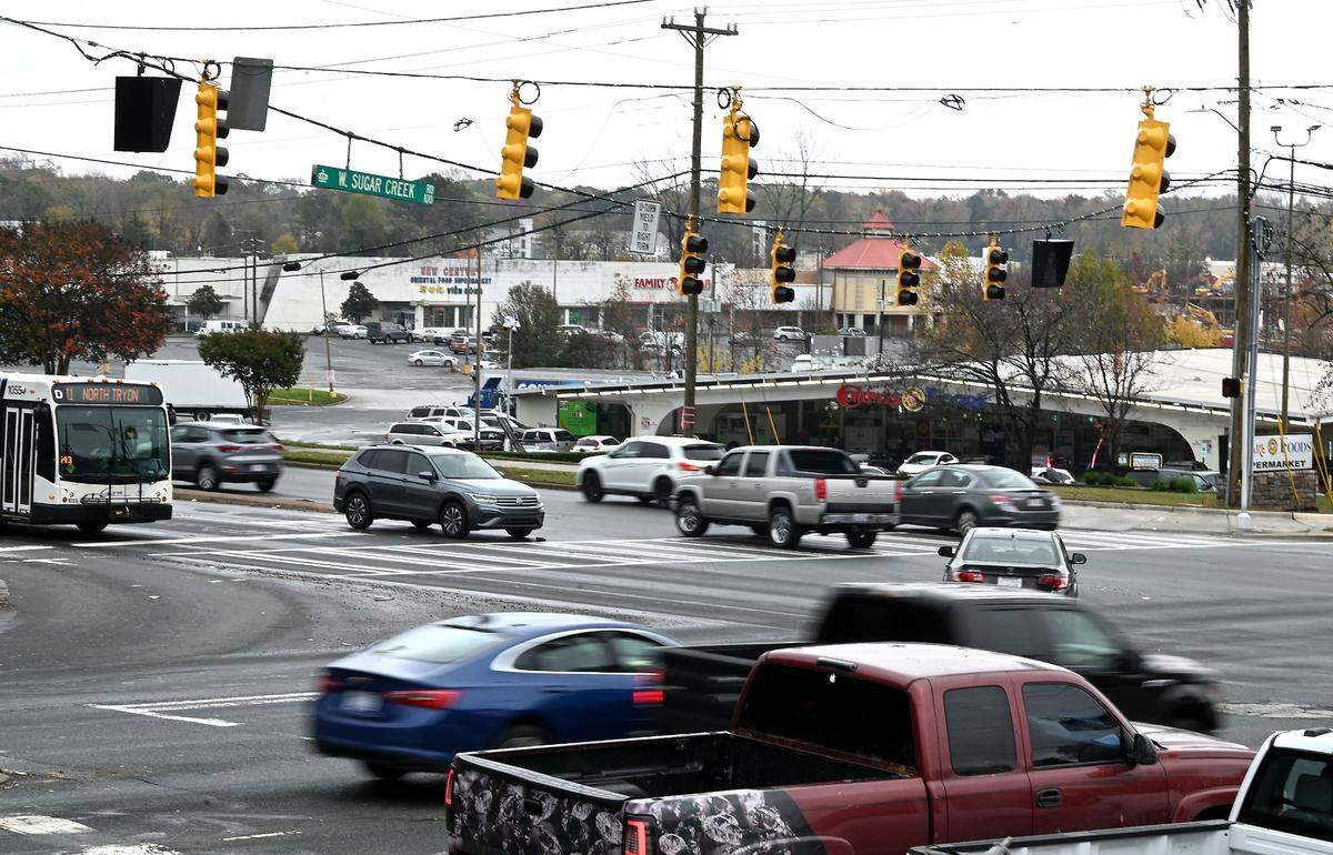 The area around West Sugar Creek Road and North Tryon Street, an intersection not far from the proposed Red Line, is busy with traffic and can expect more drivers with an increase in development.