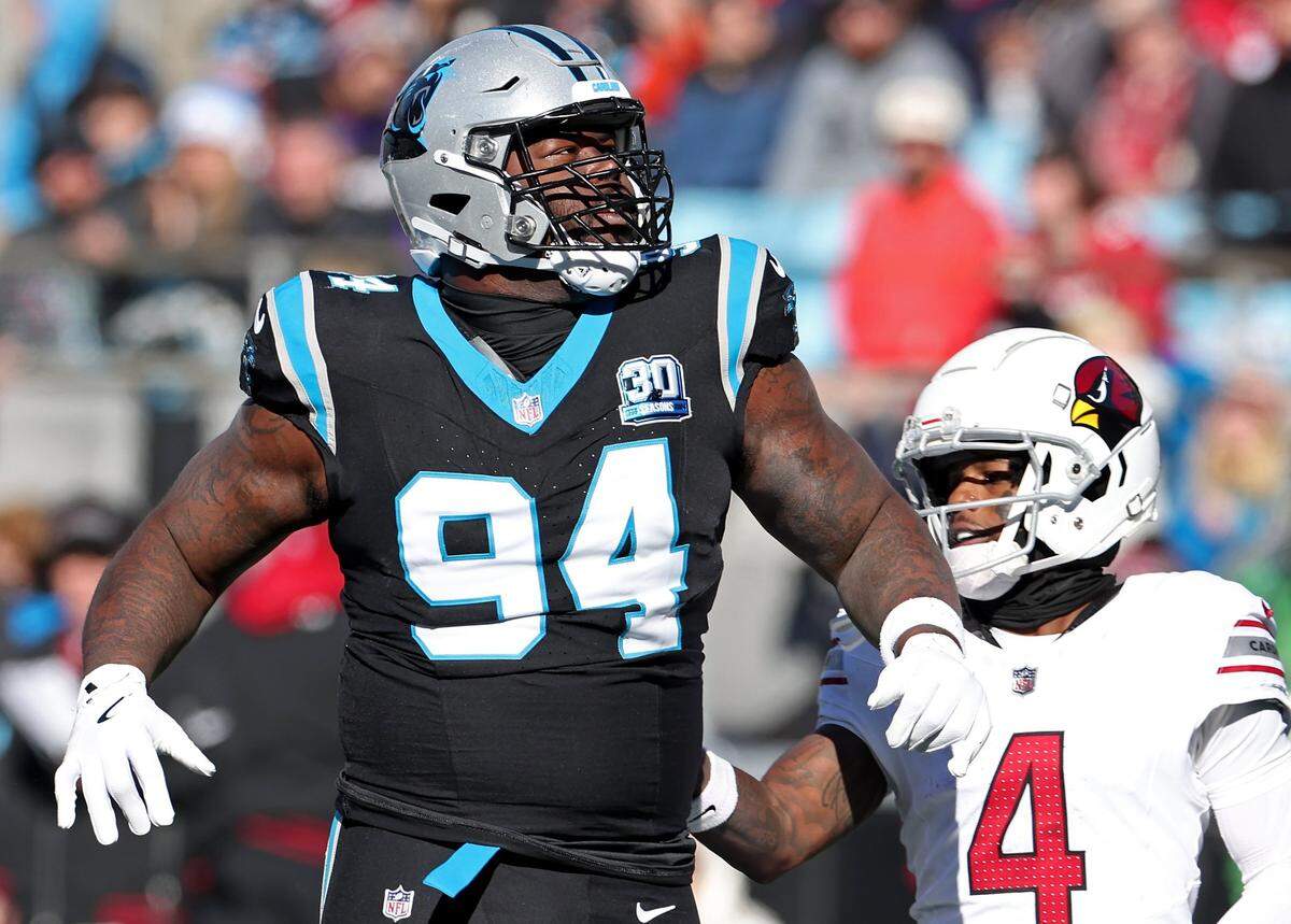 Carolina Panthers defensive end A’Shawn Robinson, left,  during action against the Arizona Cardinals at Bank of America Stadium in Charlotte, NC on Sunday, December 22, 2024. The Panthers defeated the Cardinals 36-30 in overtime.