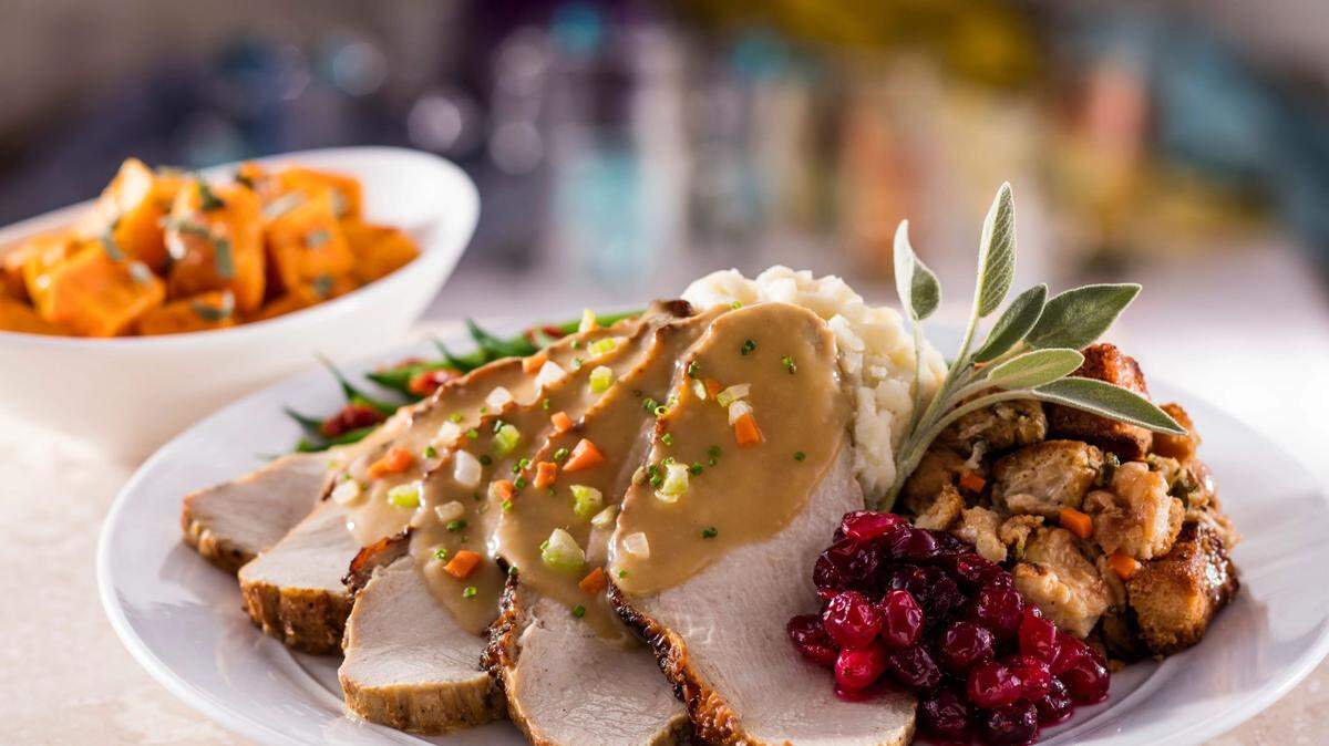Eddie V’s Thanksgiving dinner including slow-roasted turkey, brioche sage stuffing, roasted butternut squash and more.