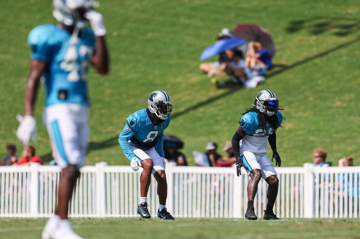 Panthers cornerbacks Jaycee Horn, center, and Dante Jackson, right, during practice at Training Camp on Tuesday, August 2, 2022 in Spartanburg, SC.