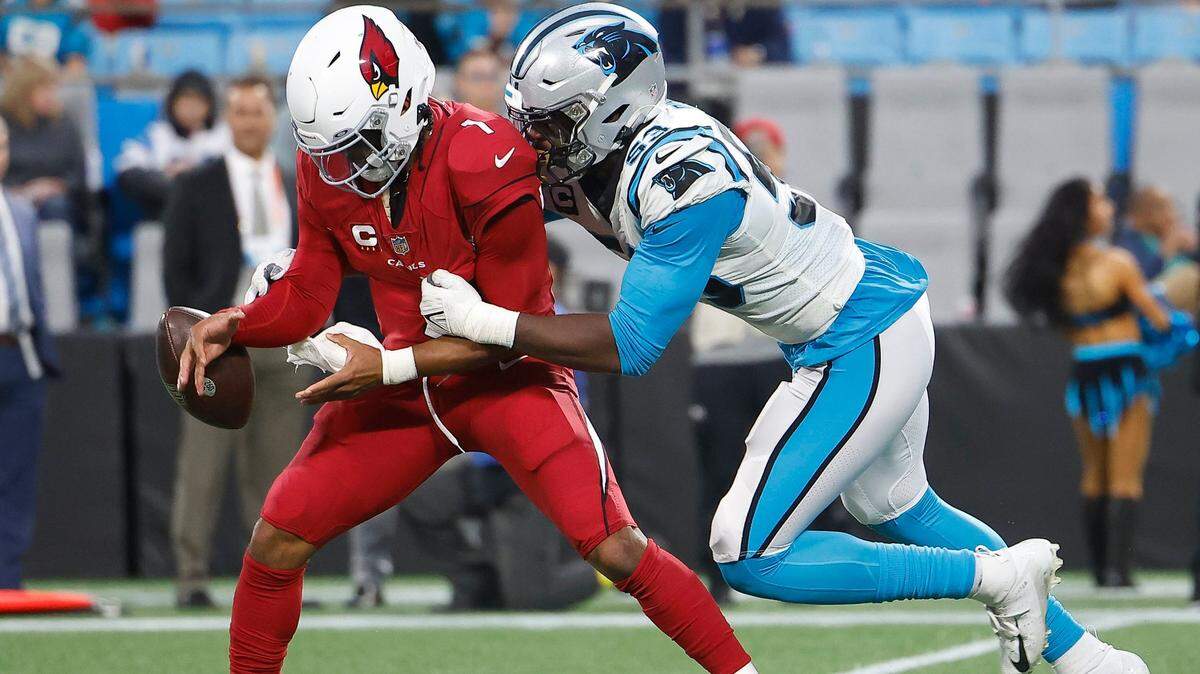 Arizona Cardinals quarterback Kyler Murray (1) fumbles as he is tackled by Carolina Panthers defensive end Brian Burns (53) during a game at Bank of America Stadium in Charlotte, N.C., Sunday, Oct. 2, 2022.