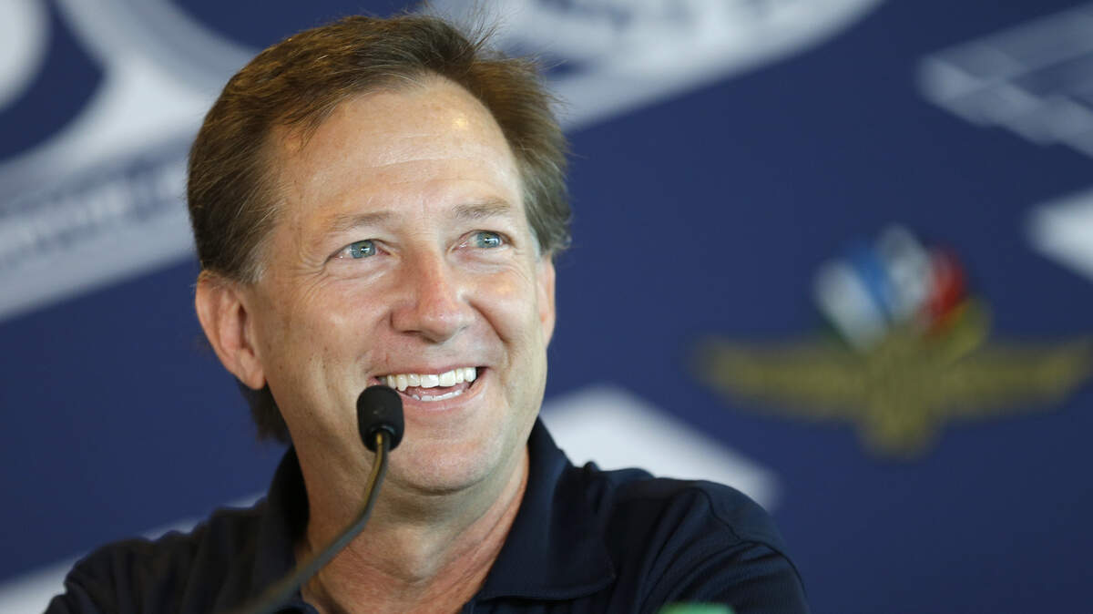 FILE - In this May 18, 2017, file photo, former race car driver John Andretti talks about his battle with colon cancer during a press conference at Indianapolis Motor Speedway in Indianapolis. Andretti is back in the garage after having his spleen and gall bladder removed last month. The former NASACAR and IndyCar driver returned to the team’s Indianapolis headquarters, Indy television station WTHR reported. (AP Photo/Michael Conroy, File)