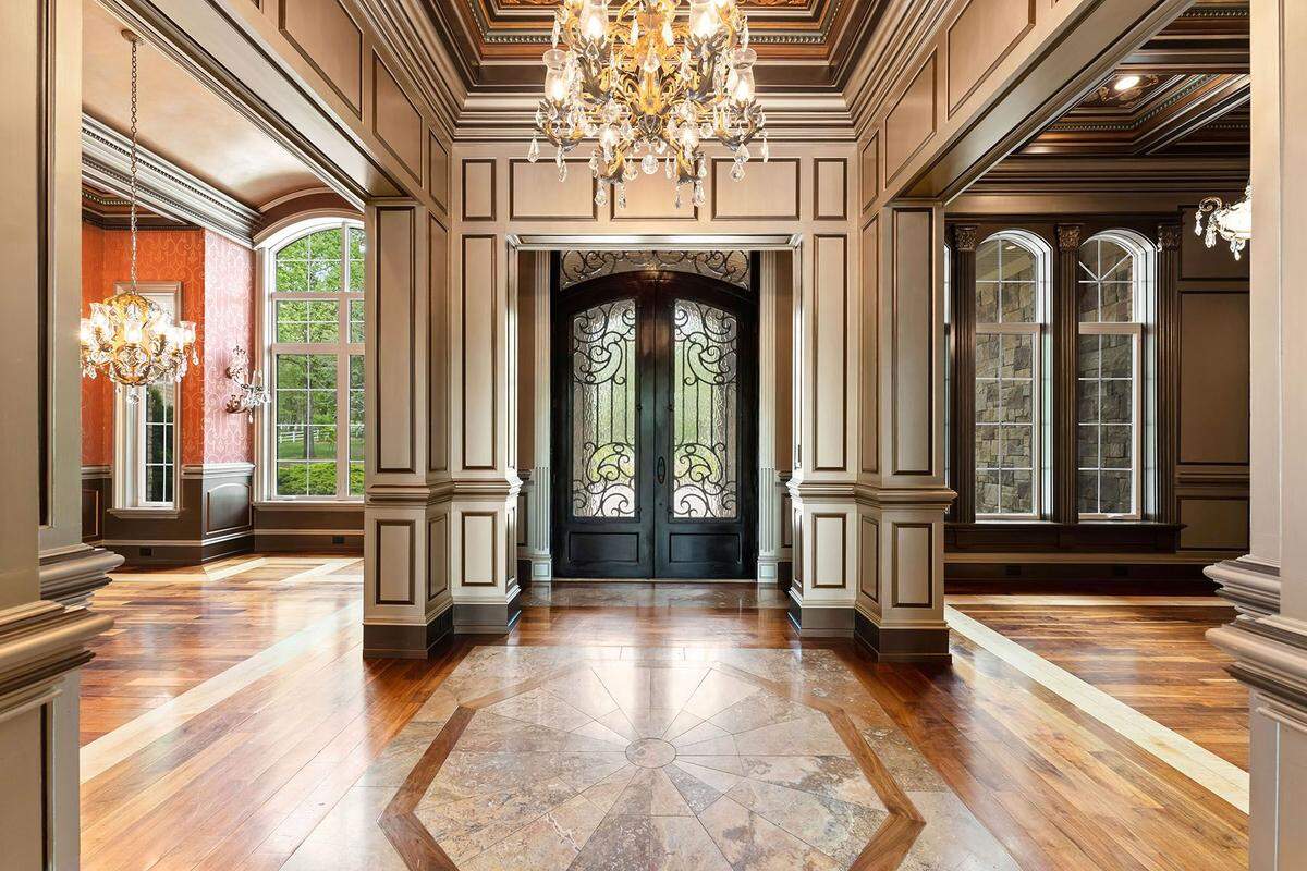 Soaring ceilings and expansive windows highlight the spacious interiors of the mansion.