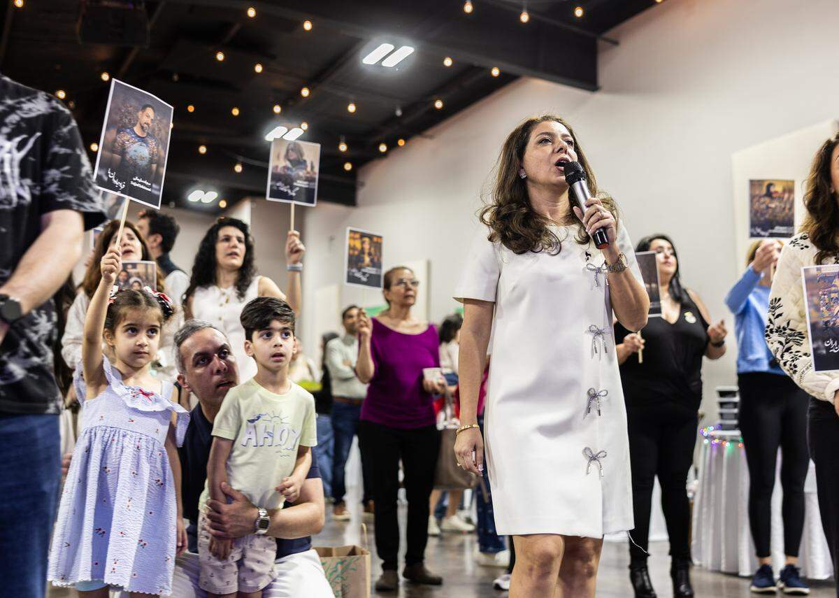 Anahita Kaviani sings a song at the Nowruz Bazaar in remembrance of Iranians that were killed during demonstrations against the Iranian government.