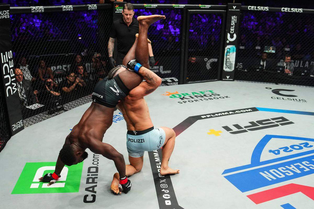 Impa Kasanganay, left, is upended by Alex Polizzi during 2024 PFL 2 at The Theater at Virgin Hotels in Las Vegas on Friday, April 12, 2024.