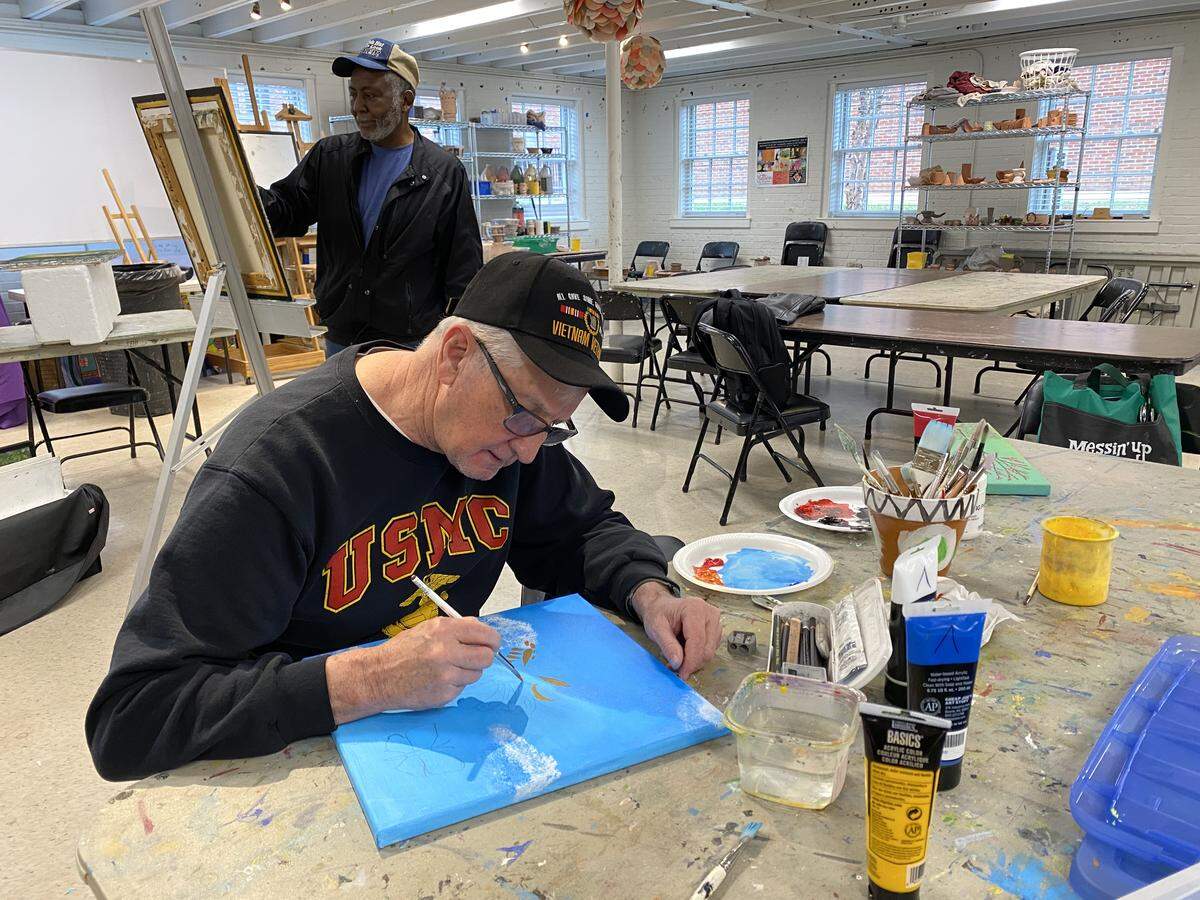 Jim Wilson, a Marine Corp veteran, and Lewis Patterson, an Army vet, work on projects at the McDowell Arts Center in Matthews. Both are in the Art for Veterans program there.