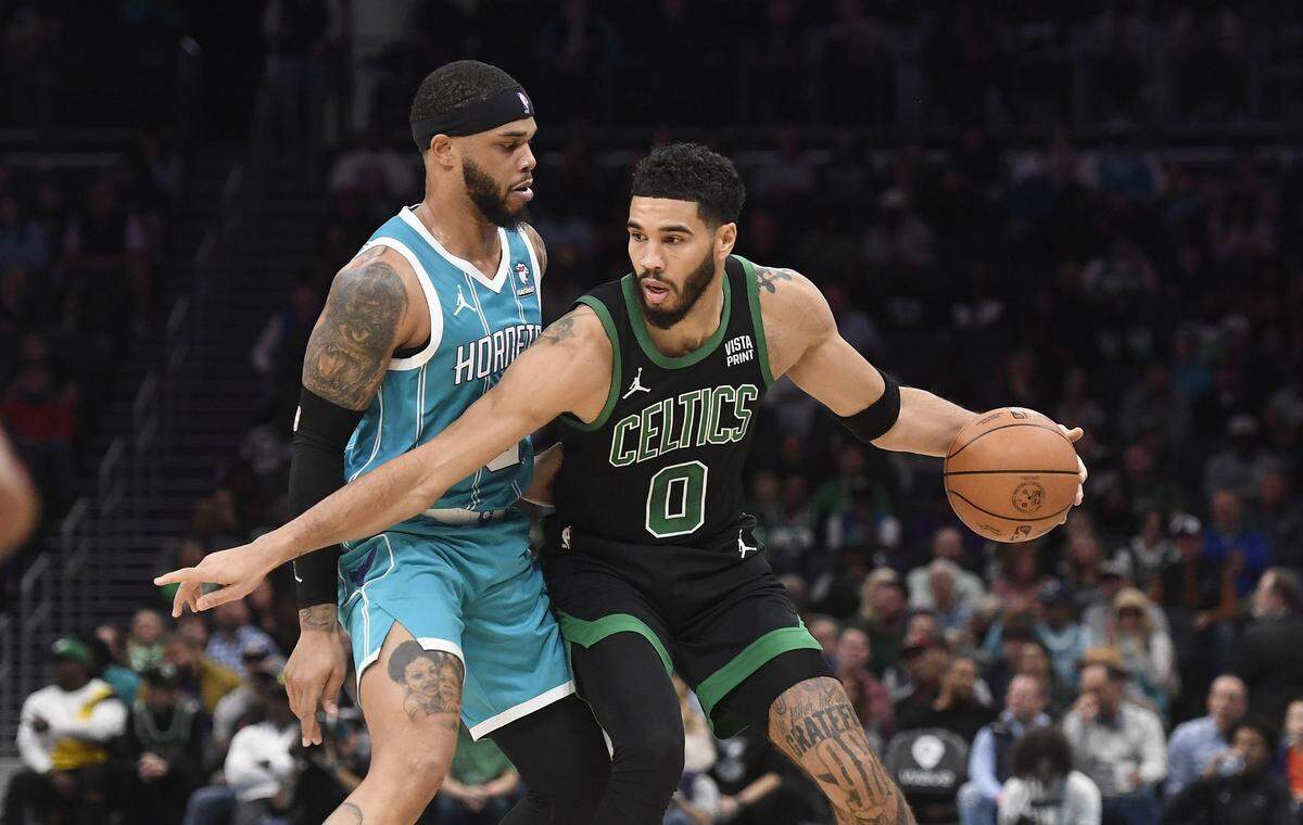 Boston Celtics forward Jayson Tatum (0) looks to drive past Charlotte Hornets forward Miles Bridges (0) during the first half at the Spectrum Center.