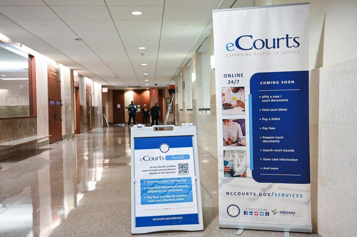 Signs announcing that eCourts would soon debut at the Mecklenburg County Courthouse in Charlotte in September 2023. 