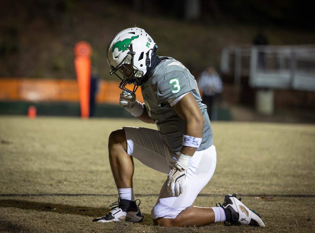 Myers Park running back Josh Falzarano (3) celebrates his 1st quarter touchdown. Myers Park would host the Chamber Cougars in the second round of the NCHSAA football playoffs Friday November 14, 2025.