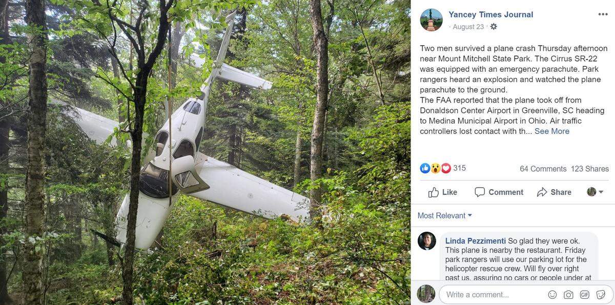 A plane deployed a parachute before crashing on Mount Mitchell, officials said.