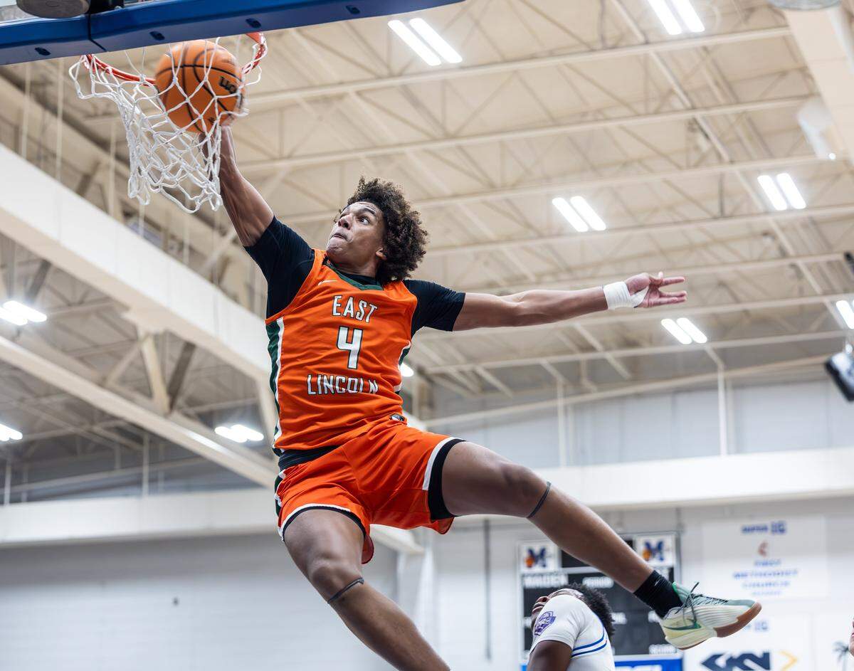 East Lincoln Mustangs Jaxon Dollar dunks against the Maiden Blue Devils at Maiden High School in Maiden, N.C., on Monday, Jan. 12, 2025.