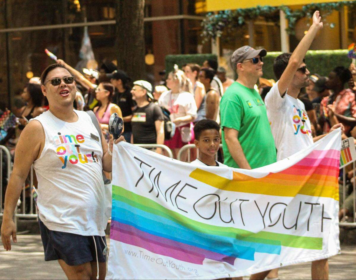 Time Out Youth, a youth center in Charlotte that provides education, advocacy and support to LGBTQ+ youth ages 13-24, marches in the 2023 Charlotte Pride Parade.