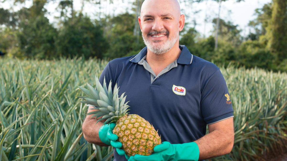 Dole Food is relocating its U.S. headquarters from one Tryon Street tower in uptown Charlotte to another nearby tower. Seen here is a farmer with a Dole pineapple.