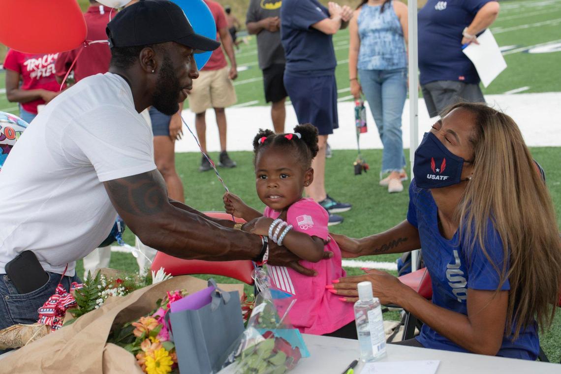 Mallard Creek strength and conditioning coach Donald Littlejohn introduces his daughter, Gabriella Littlejohn, to his former star athlete Gabbi Cunningham. Littlejohn named his daughter after the Olympian.
