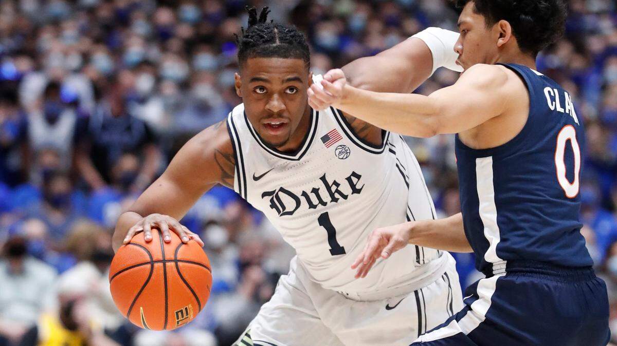 Duke’s Trevor Keels (1) drives as Virginia’s Kihei Clark (0) defends during the first half of Duke’s game against Virginia at Cameron Indoor Stadium in Durham, N.C., Monday, Feb. 7, 2022.