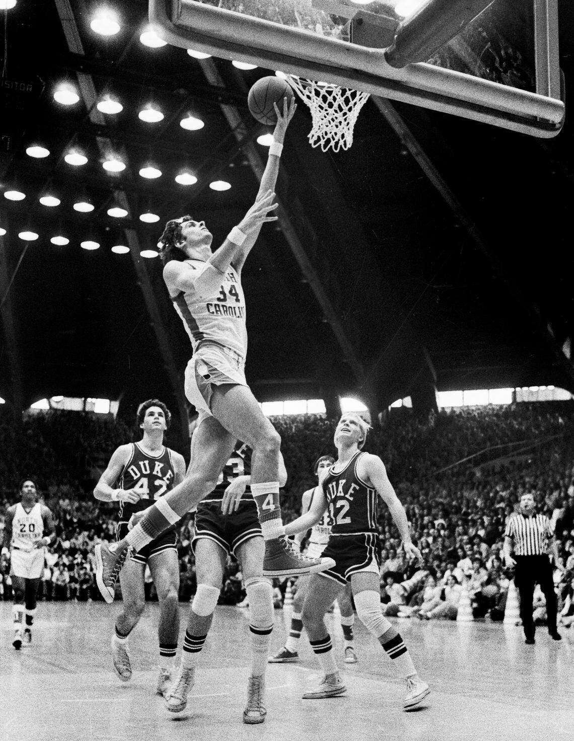 A natural lefty, Bobby Jones was taught to shoot right-handed by his father. Near the basket, though -- as on this drive against Duke in 1974 -- he often switched the ball to his left hand.