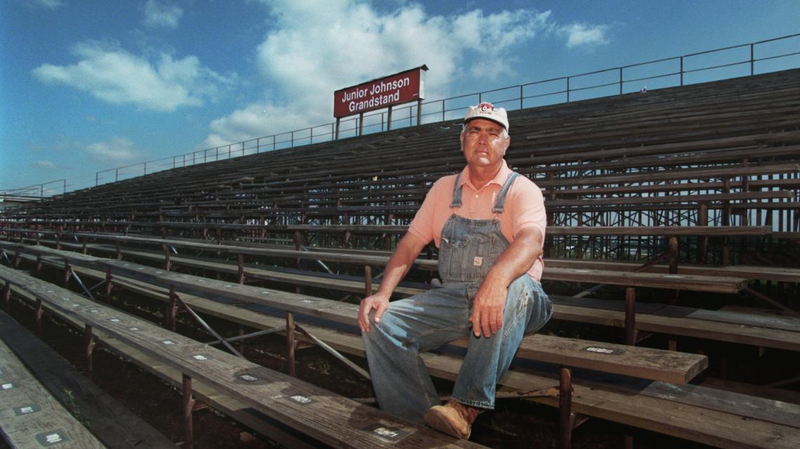 Sitting in the grandstand named after him, Junior Johnson looks out at the backstretch at North Wilkesboro Speedway in a 1996 photo.