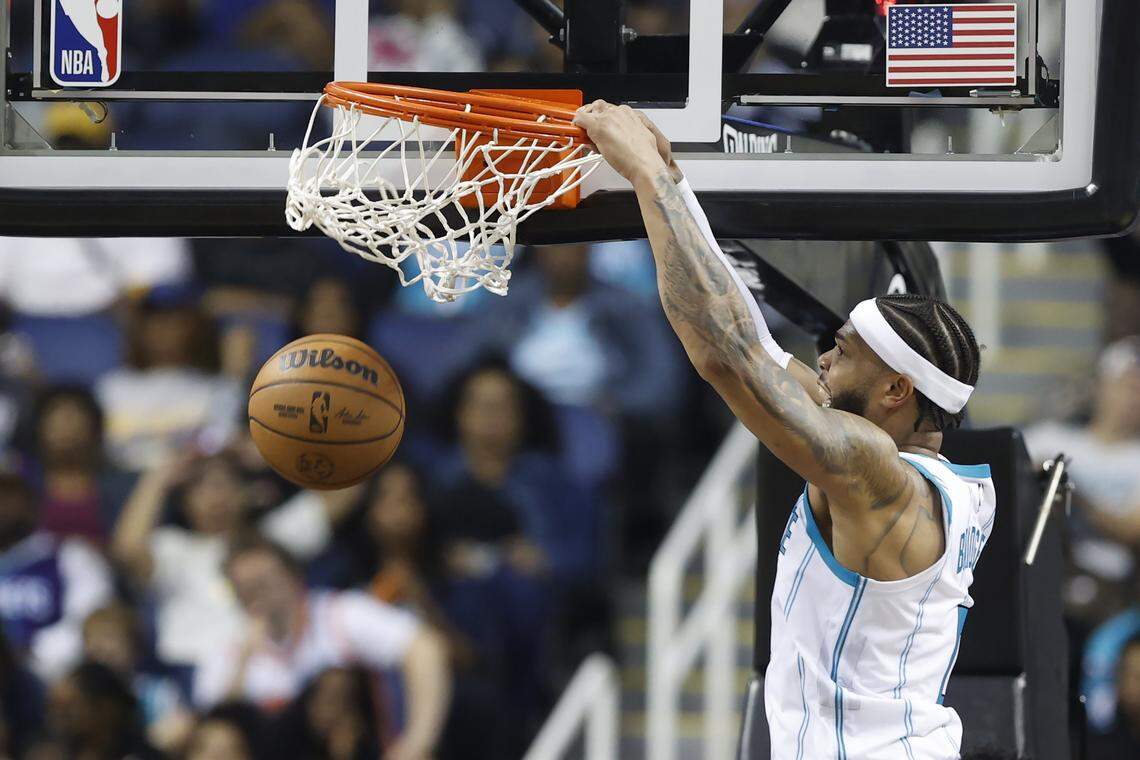 Charlotte Hornets forward Miles Bridges follows through on a slam dunk during the second half against the Memphis Grizzlies at First Horizon Coliseum.