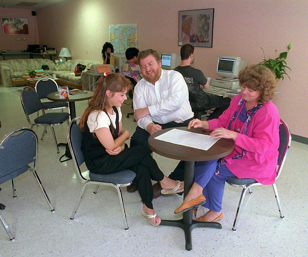 Bob and Cathe Graves, with Cathe’s daughter, Rebekah Williams, left, are shown in 1995 at The On-Ramp, their new cyber cafe in Matthews. With its suburban location, The On-Ramp was an example at the time of how computers and cyber cafes were moving from the curious to the commonplace in people’s lives.