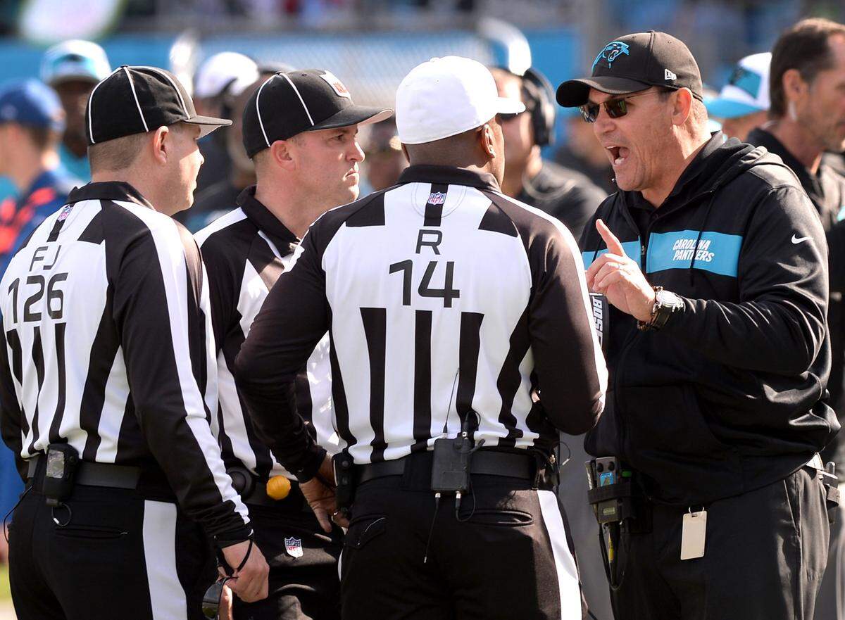 Carolina head coach Ron Rivera, right, makes a point to officials during the Panthers’ 30-27 loss Sunday to Seattle. The Panthers have lost three games in a row.