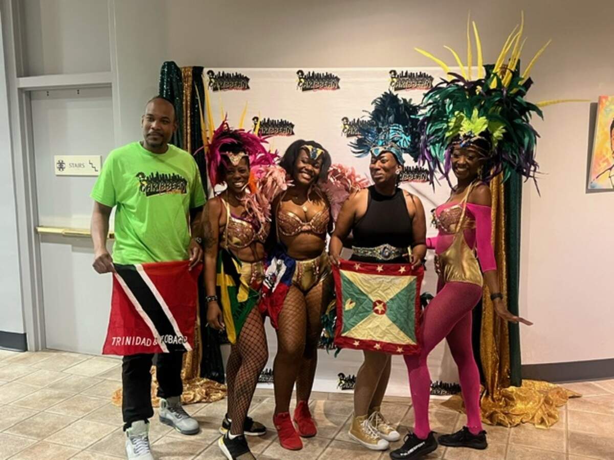Matthew Thomas, left, a native of Trinidad and Tobago, with other Charlotte Caribbean Carnival committee members.