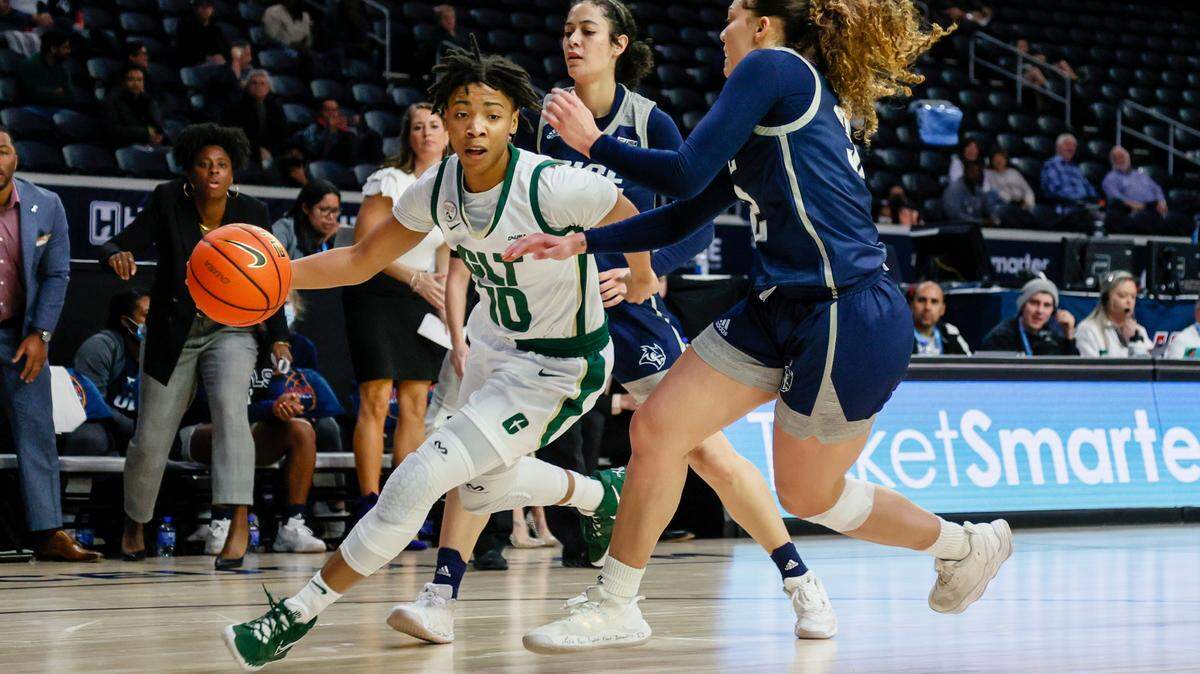 Charlotte’s Dazia Lawrence drives toward the basket against Rice defenders on Thursday during the Conference USA tournament in Frisco, Texas. The 49ers won, 59-53, to advance to the semifinals.