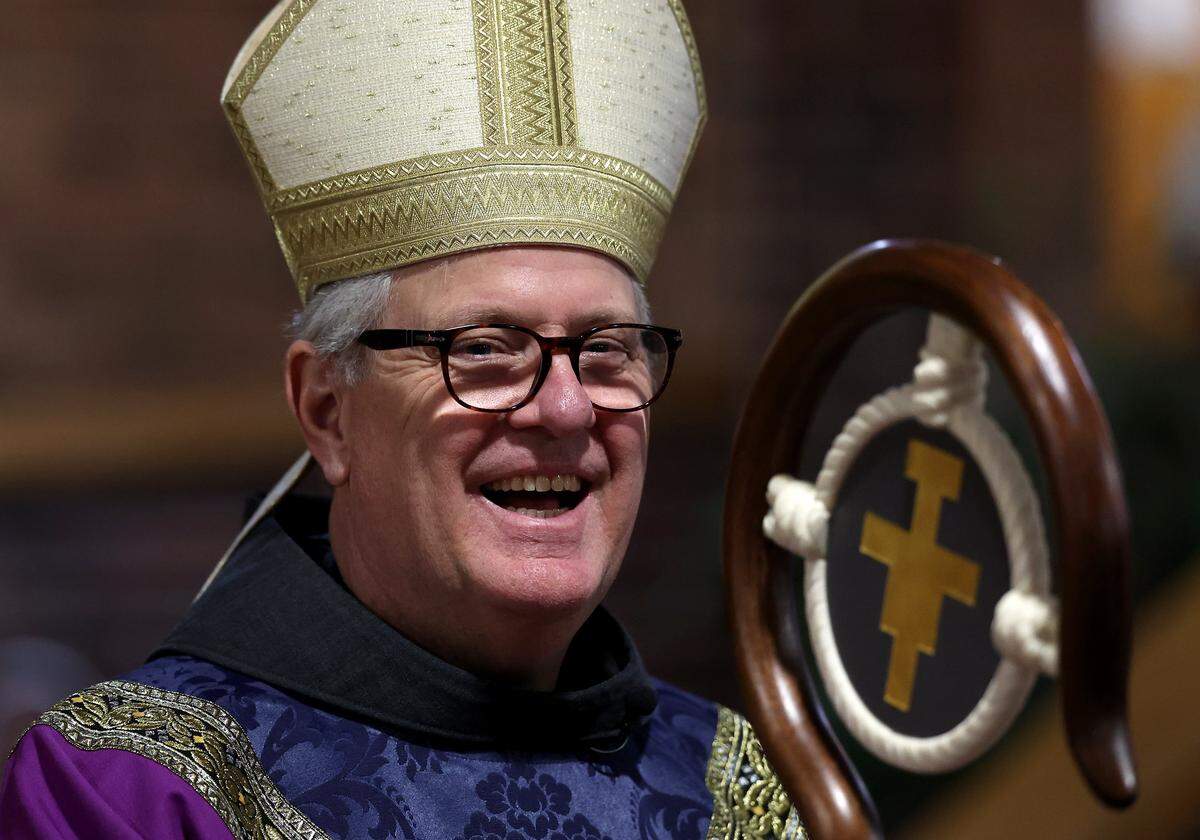Bishop Michael Martin enjoys time with others prior to a Mass at St. John Neumann Catholic Church in Charlotte, NC on Wednesday, February 18, 2026. Bishop Martin is laying out his vision for the church and some of his initial actions have faced scrutiny.
