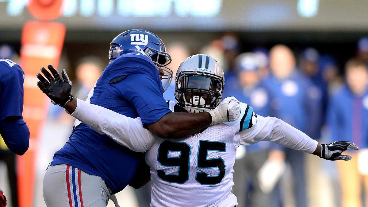 Former New York Giants lineman Marshall Newhouse, left, shown in 2015 blocking former Carolina Panthers defensive end Charles Johnson, was traded to the Carolina Panthers from the Buffalo Bills on Tuesday.
