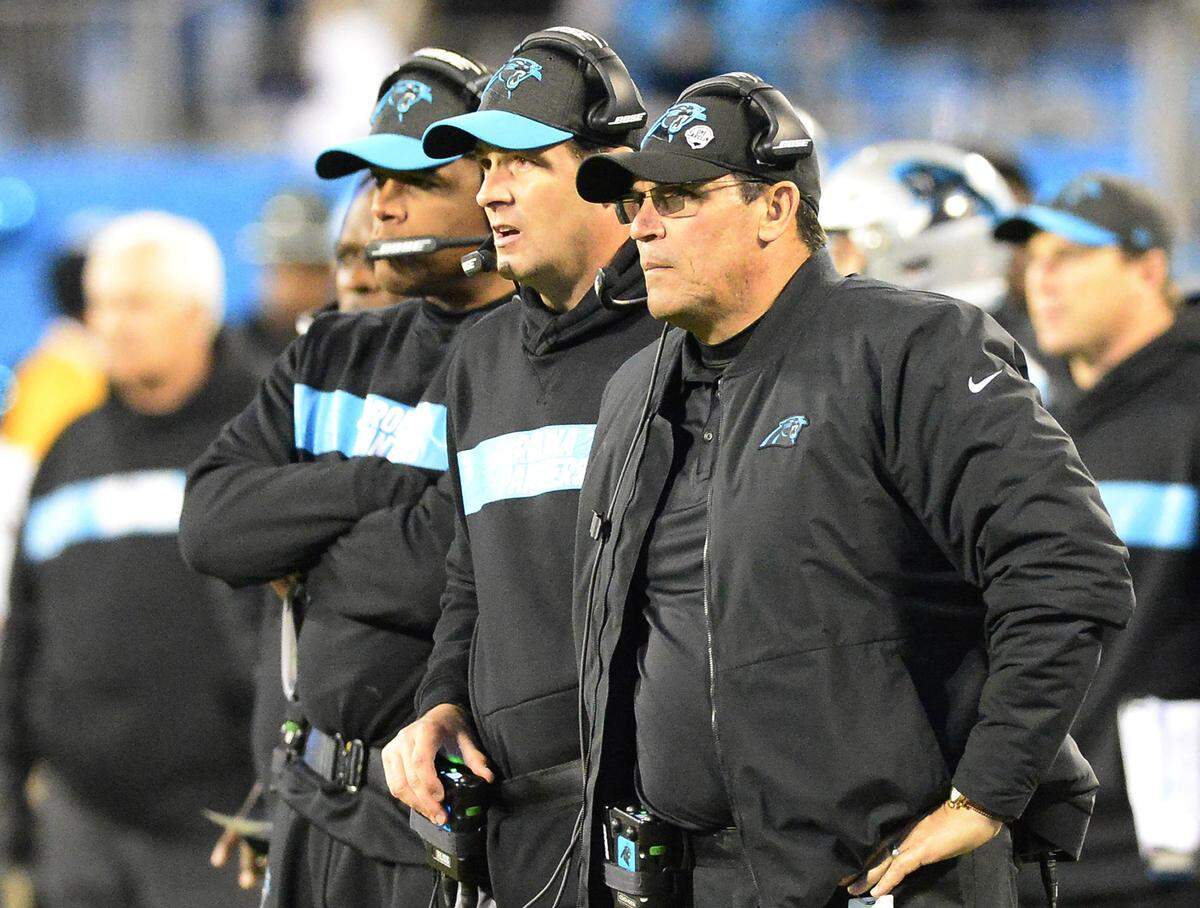 Carolina Panthers head coach Ron Rivera, right, looks on as the defense tries to stop the New Orleans Saints late in the game at Bank of America Stadium on Monday, December 17, 2018. The Saints won, 12-9.