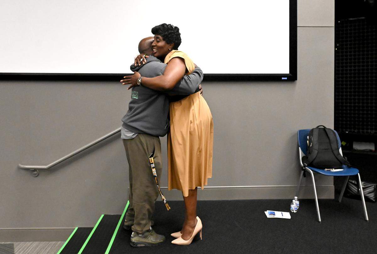 Charlotte City Council member Tiawana Brown, right, receives a supportive hug following a town hall meeting at Good Shepherd Church in Charlotte, NC on Wednesday, May 28, 2025. Brown was indicted on federal charges last week.