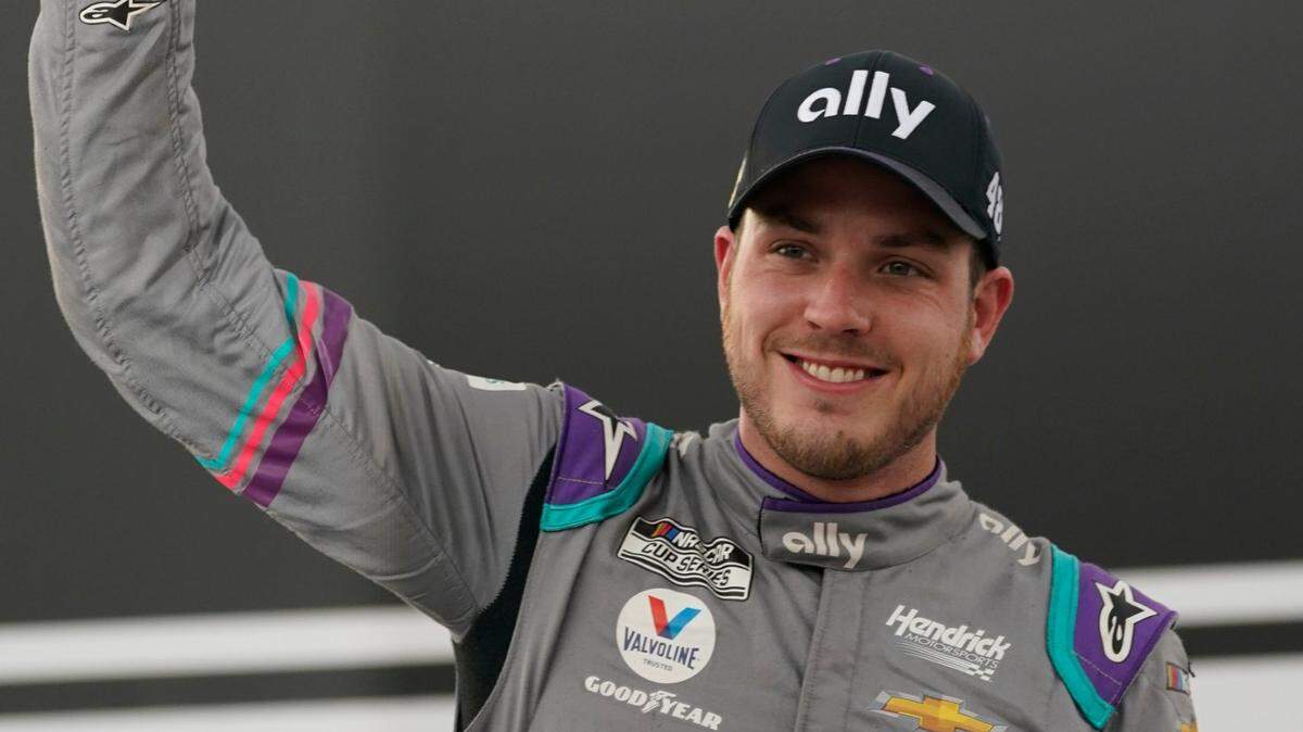 Alex Bowman (48) celebrates after winning a NASCAR Cup Series auto race at Richmond International Raceway in Richmond, Va., Sunday, April 18, 2021. (AP Photo/Steve Helber)