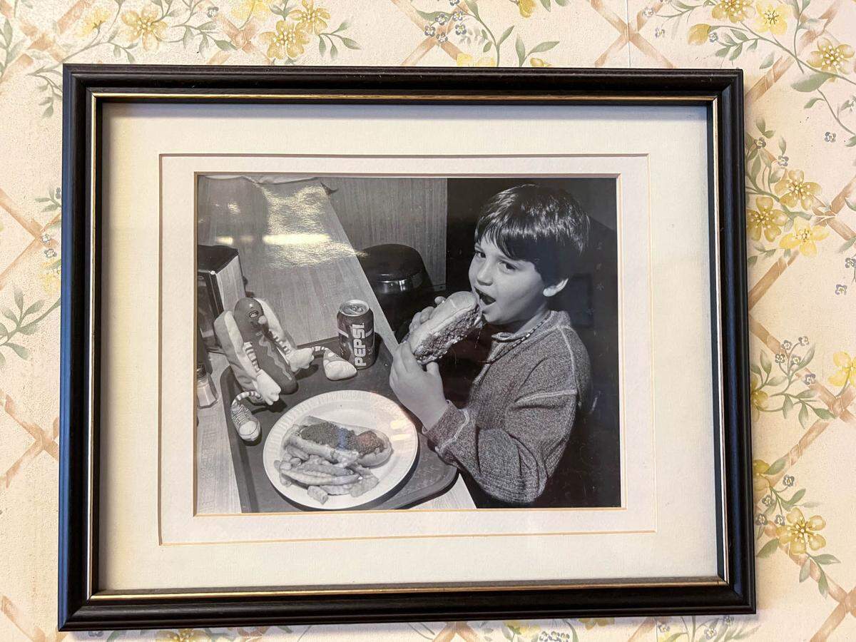 Owner’s son Nick Sikiodtis on the wall iof his parents restaurant, when he was a child eating at Green’s Lunch in uptown Charlotte.