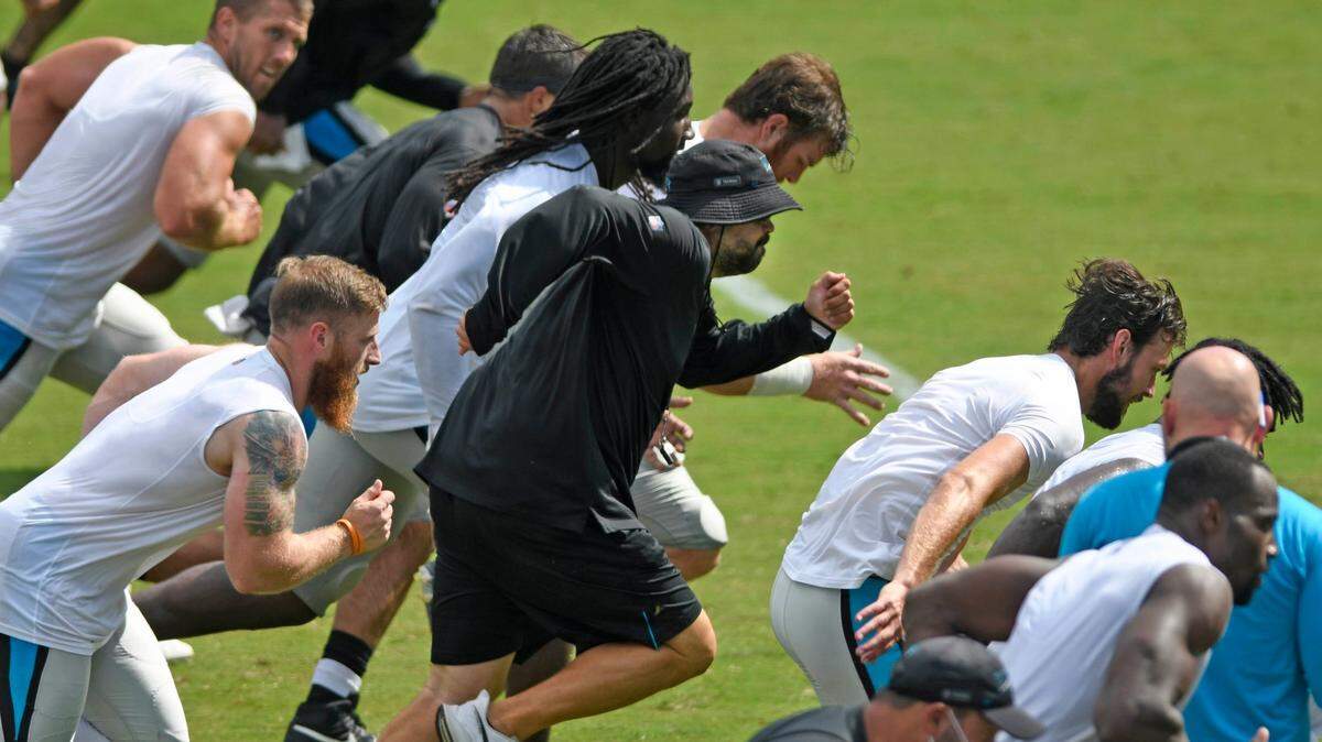 Carolina Panthers head coach Matt Rhule runs sprints with his players near the end of practice at Bank of America Stadium during training camp on Saturday, August 22, 2020.
