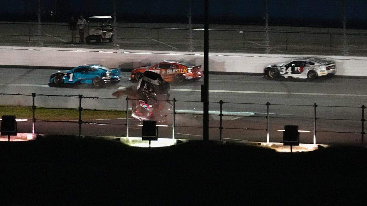 Ryan Preece flips through the grass on the backstretch after spinning out in the closing laps of the Coke Zero Sugar 400 on Saturday.