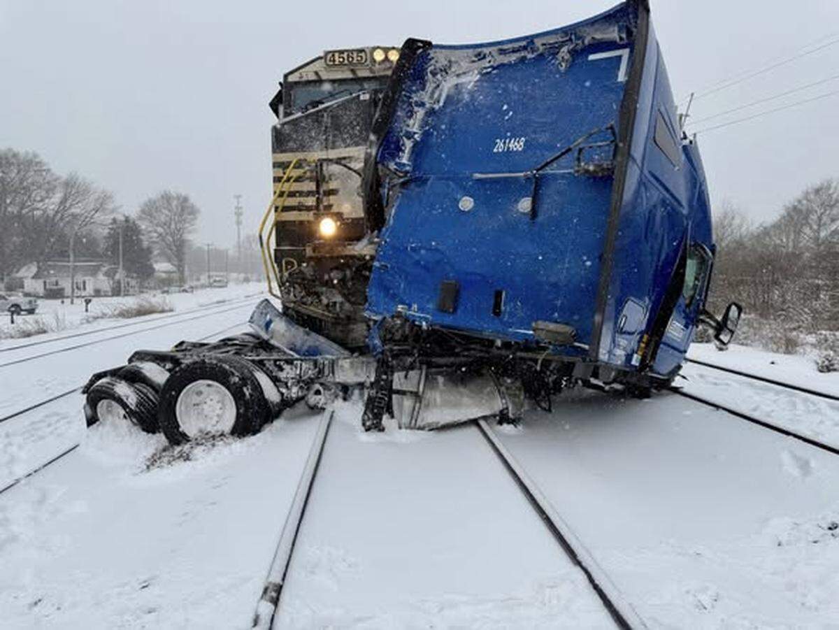 The driver of a semi-tractor trailer escaped injury when a train hit the rig at Poplar Street and Airline Avenue during a snow storm on Saturday, Jan. 31, 2026.