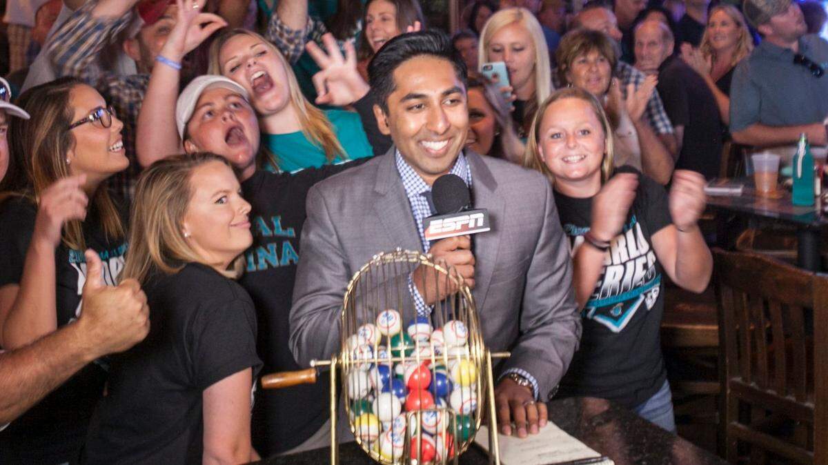 ESPN broadcaster Anish Shroff, center, pictured here in 2016, is the new radio voice of the Carolina Panthers.