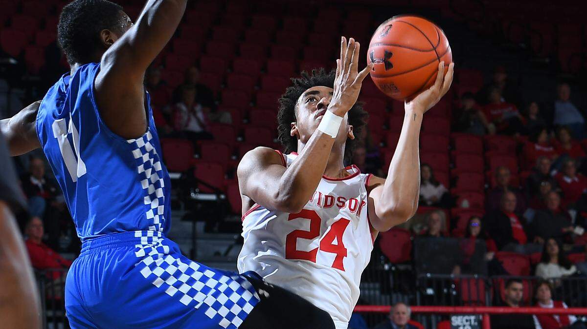 Davidson’s Carter Collins (24) goes to the basket against Glenville State’s Jaeger Martino (00) Monday.