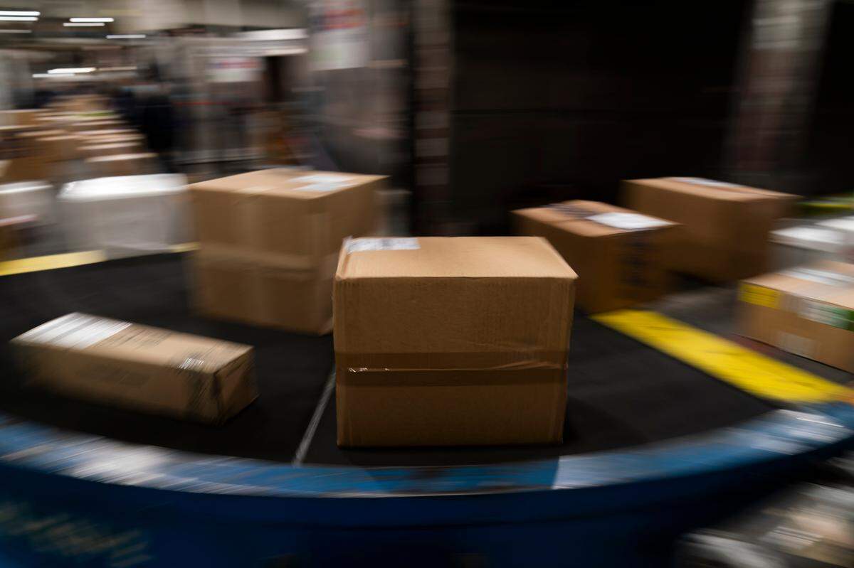 Packages move along a conveyor belt while being sorted for delivery at the FedEx regional hub at the Los Angeles International Airport in Los Angeles on Dec. 7. Deadlines for shipping holiday packages — in some cases at lower costs — are looming.