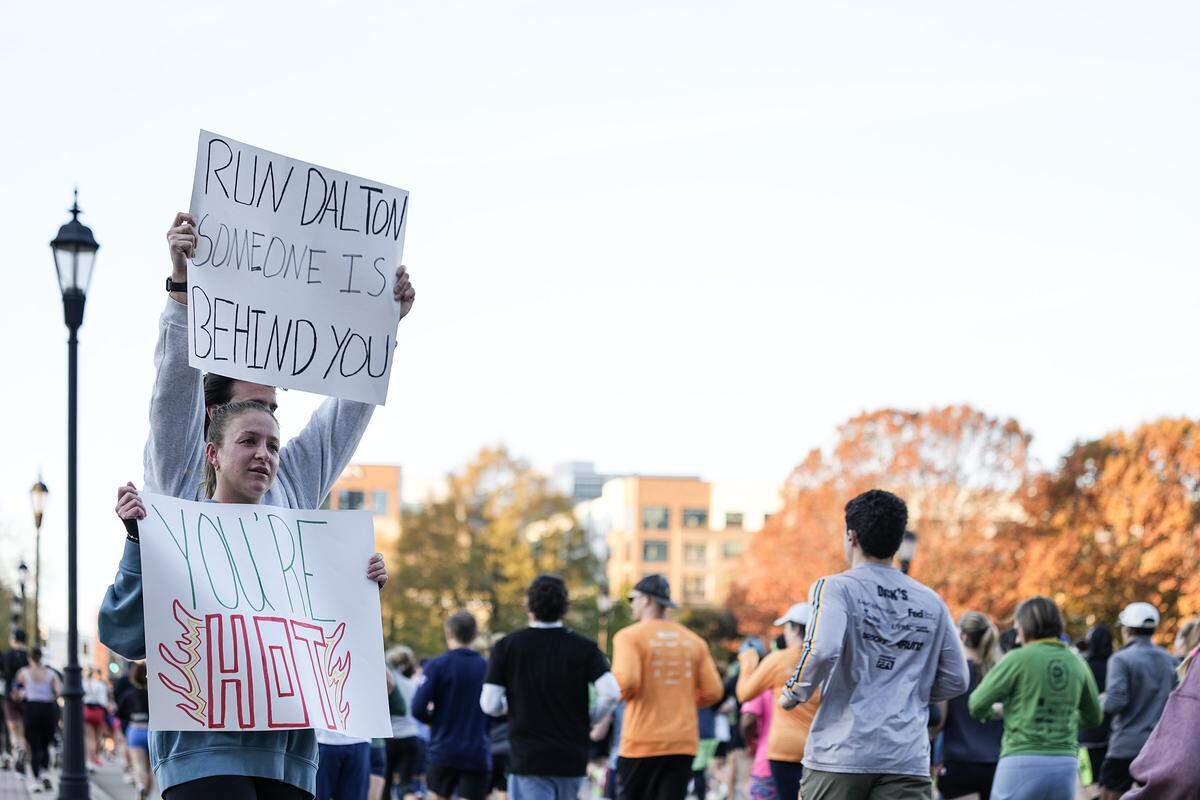 Supporters cheer on runners as they compete in the Novant Health Charlotte Marathon Saturday, Nov. 15, 2025, in Charlotte, N.C.