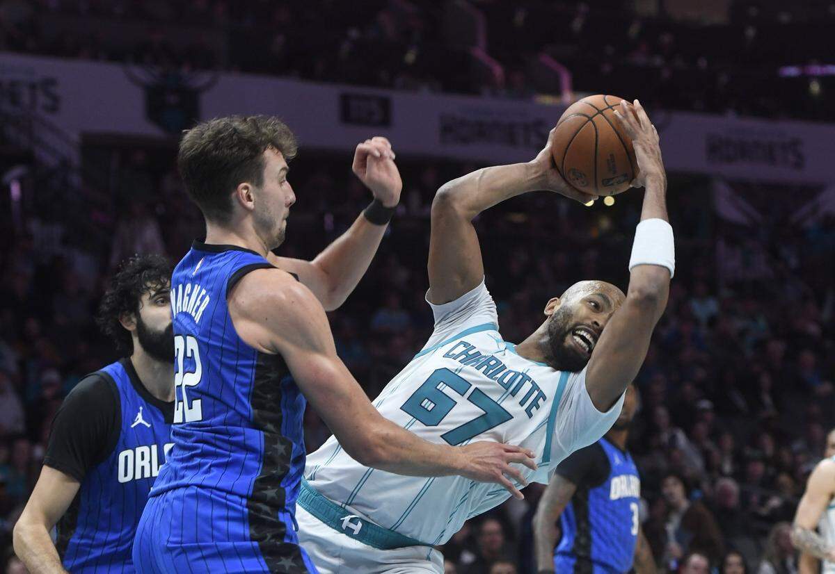 Orlando Magic forward Franz Wagner (22) defends against Charlotte Hornets center Taj Gibson (67) during the second half at the Spectrum Center.