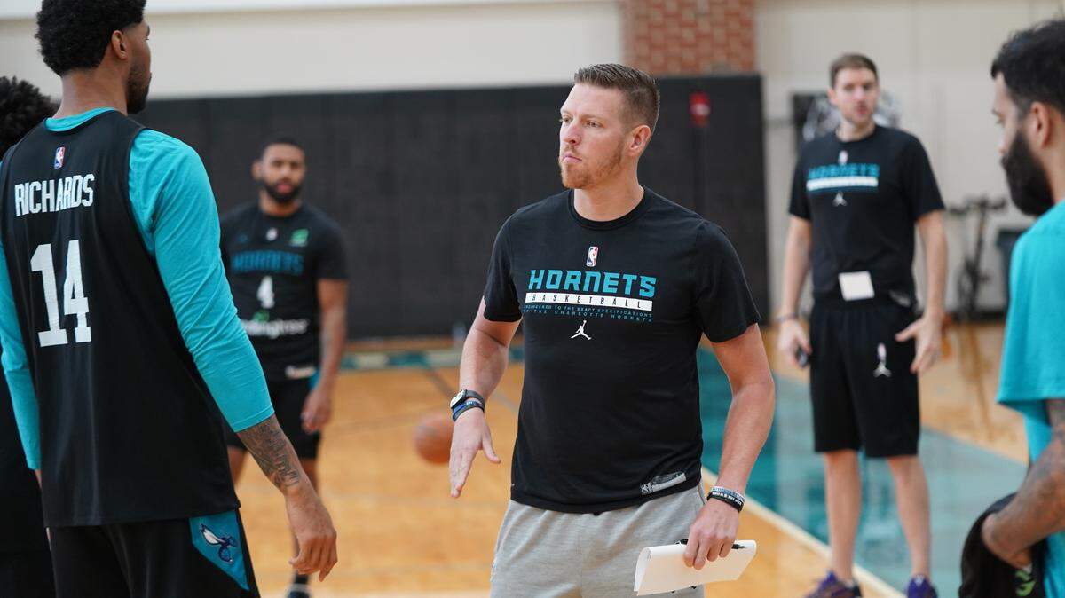 The Charlotte Hornets have named their video coordinator Jordan Surenkamp, right, as the new head coach of the Greensboro Swarm.