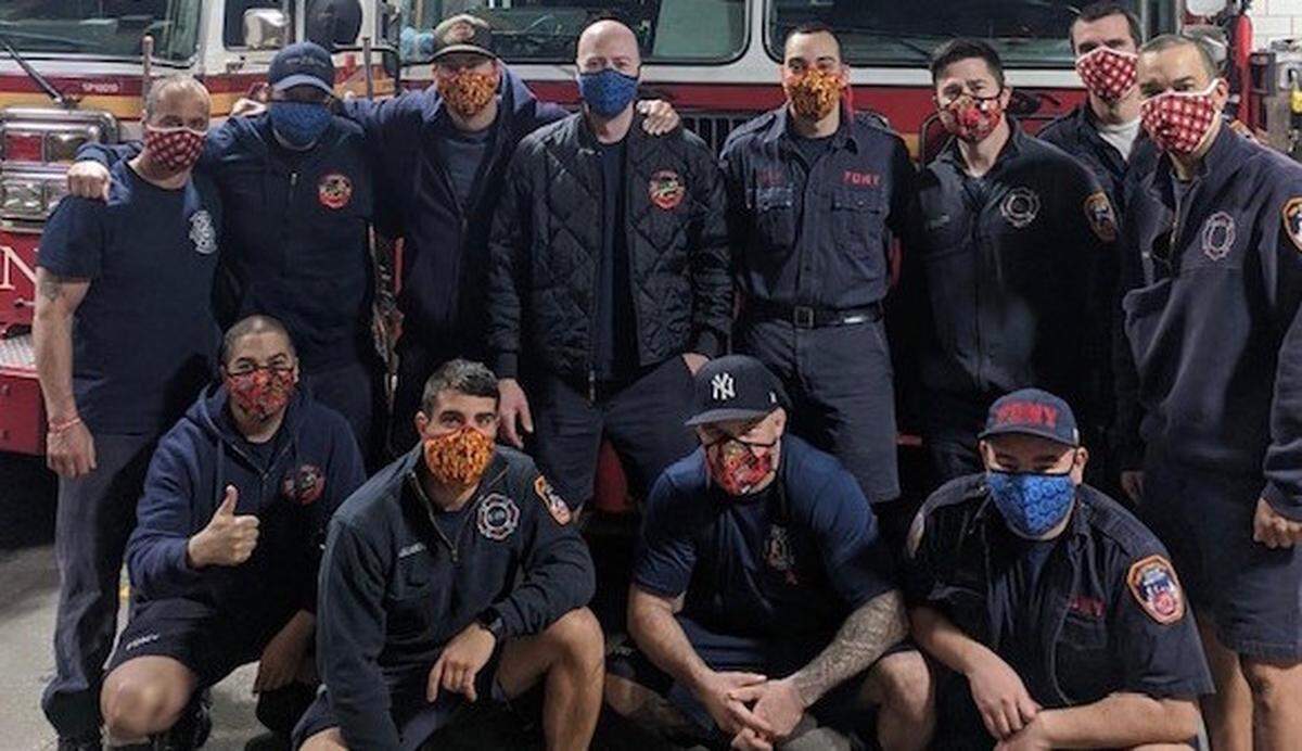 These first responders are sporting masks handmade by Kristine Fisher.