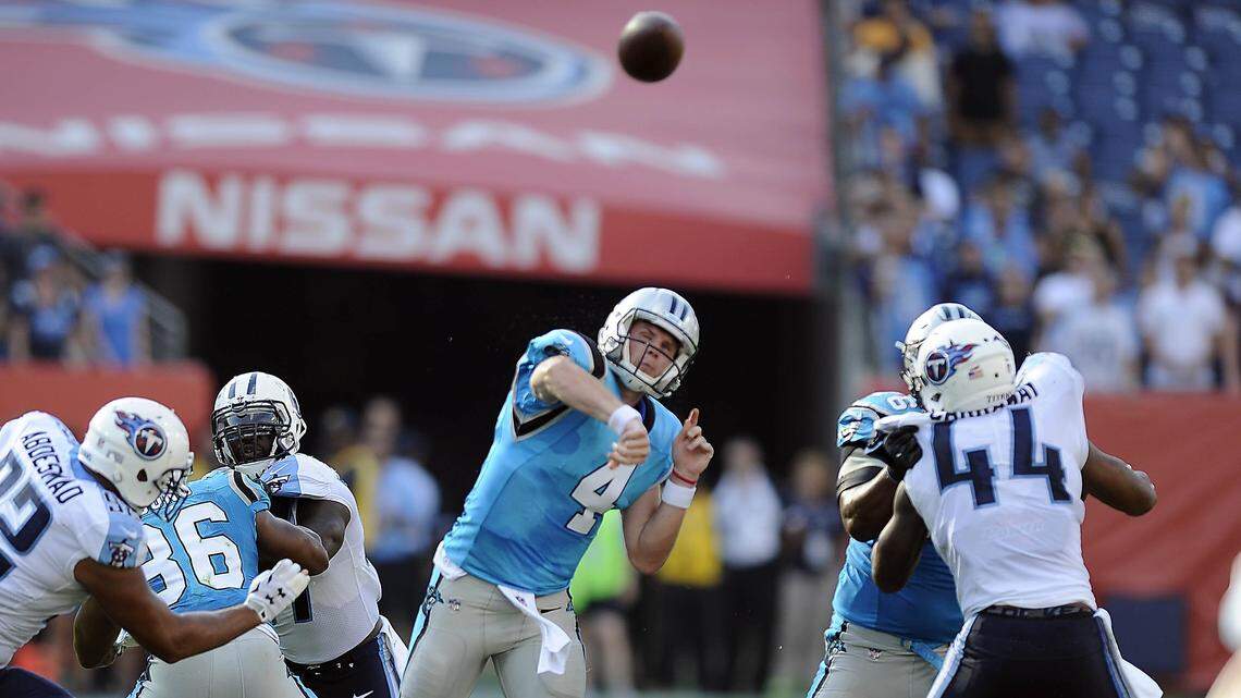 Garrett Gilbert (4) spent time on the Panthers' practice squad and active roster last season. Gilbert is one of three candidates competing this spring to be Cam Newton's backup.