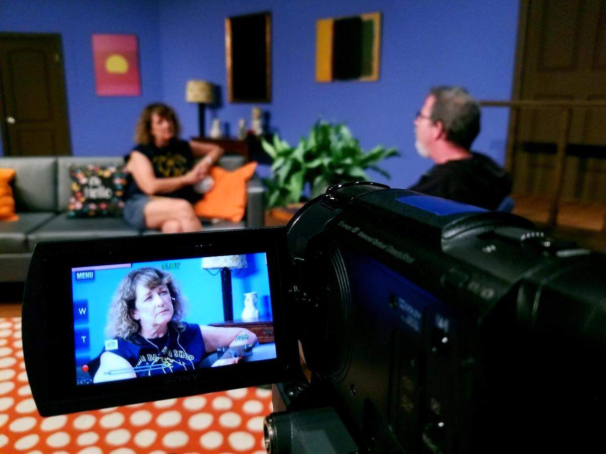 When the pandemic forced Actor’s Theatre of Charlotte to move online, local award-winning TV producer Shannon Reichley (on the screen) took on the challenge of teaching career theater people the ins and outs of television production. Speaking with Reichley is ATC Executive Director Chip Decker.
