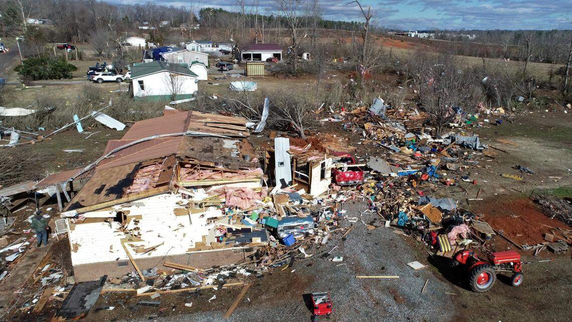 The contents of a mobile home in the Fox Hollow area along Cindi Lane are strewn across the property following a suspected tornado in Claremont, NC on Tuesday, January 9, 2024. The suspected tornado which was part of a massive storm system that covered much of the southeast on Tuesday left one dead.