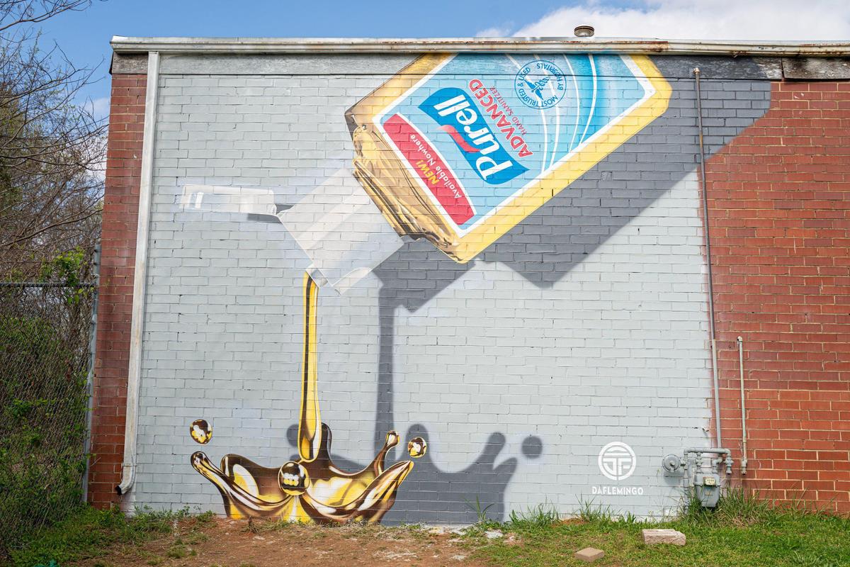 Darion Fleming (Daflemingo) has painted a mural on Davidson Street near Southern Tiger Collective of Purell hand sanitizer as gold.