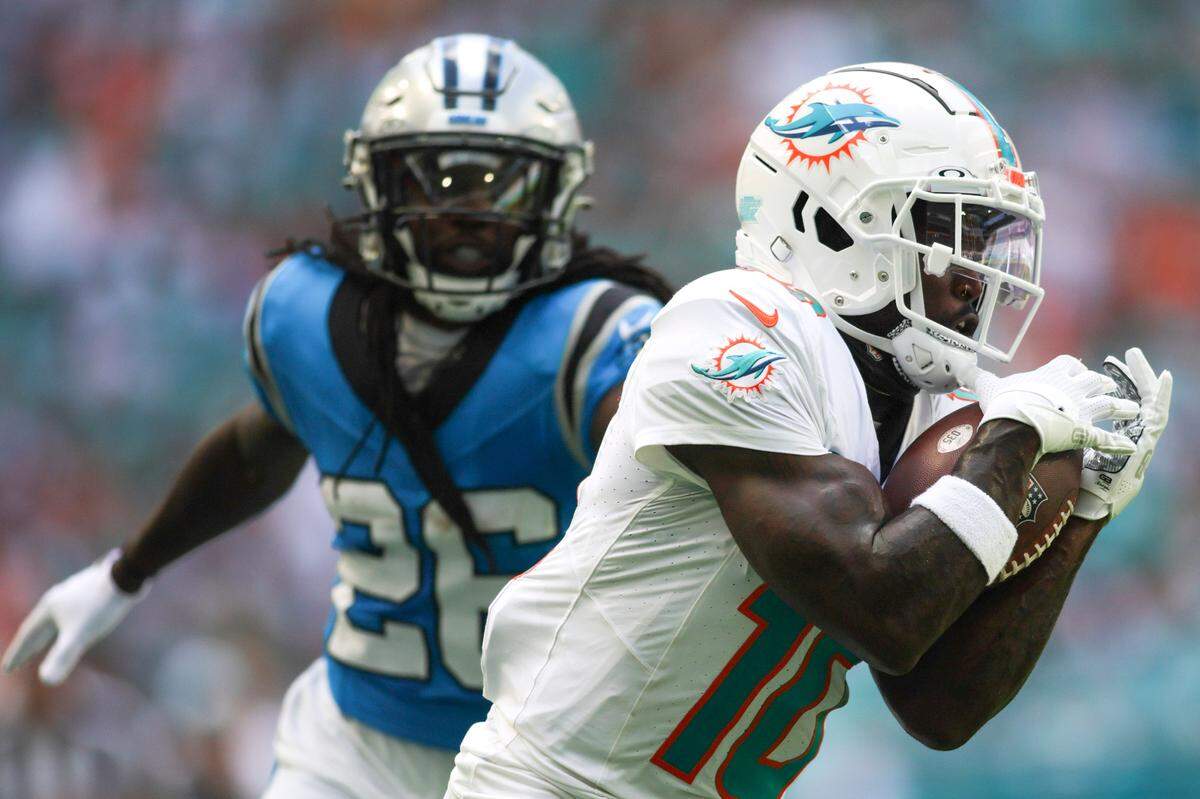 Oct 15, 2023; Miami Gardens, Florida, USA; Miami Dolphins wide receiver Tyreek Hill (10) catches the football for a touchdown against Carolina Panthers during the second quarter at Hard Rock Stadium. Mandatory Credit: Sam Navarro-USA TODAY Sports